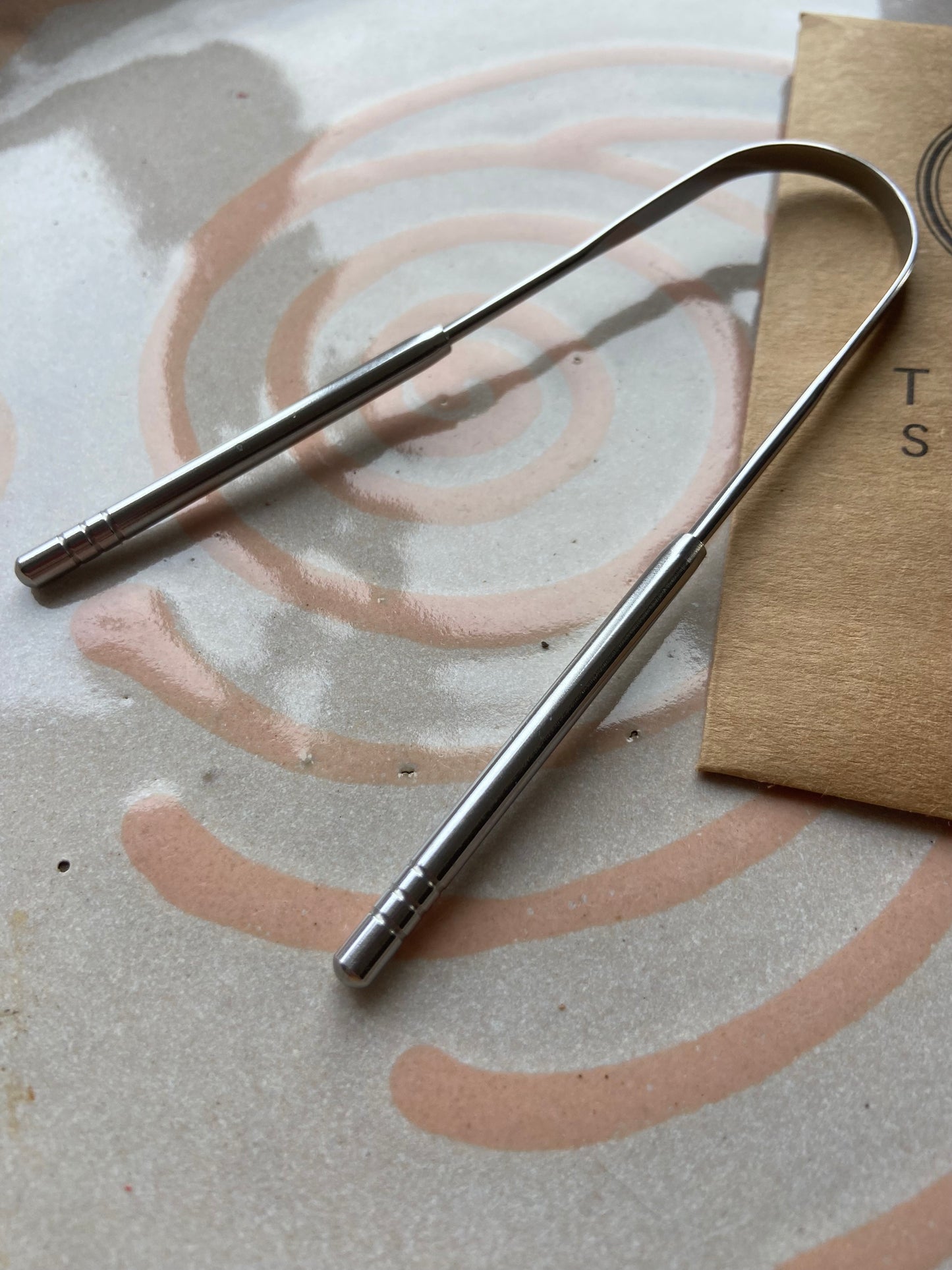 Silver tongue scraper