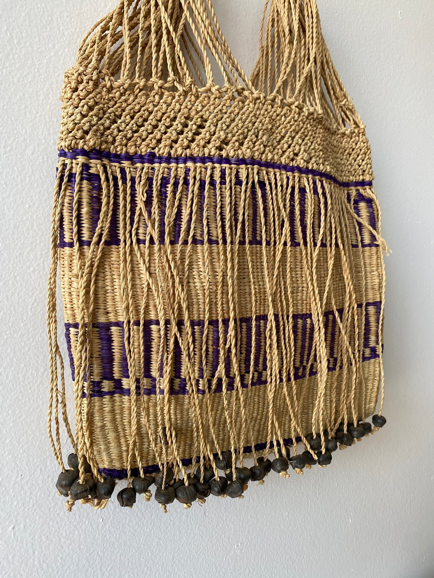 Straw bag with dangling beads