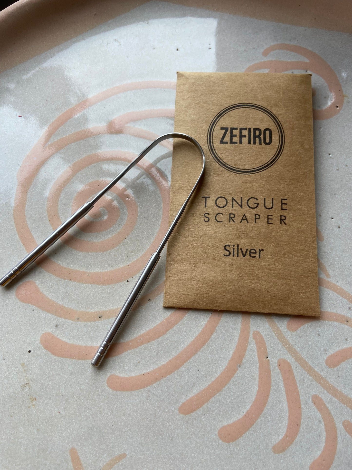Silver tongue scraper
