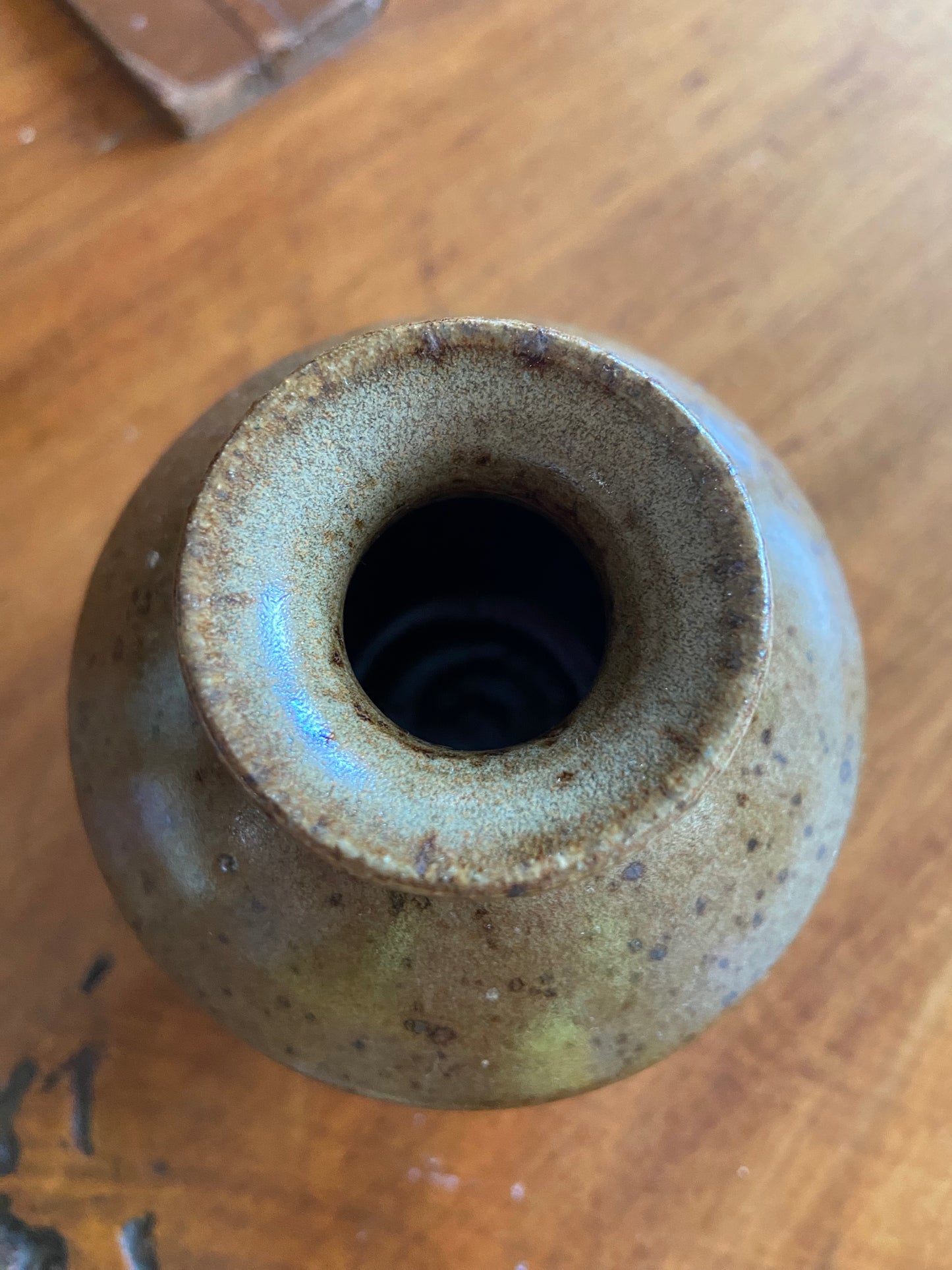 Small brown and multicolored glazed vase