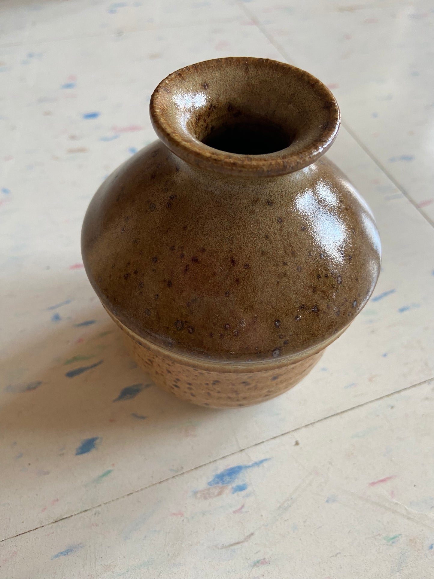 Small brown and multicolored glazed vase