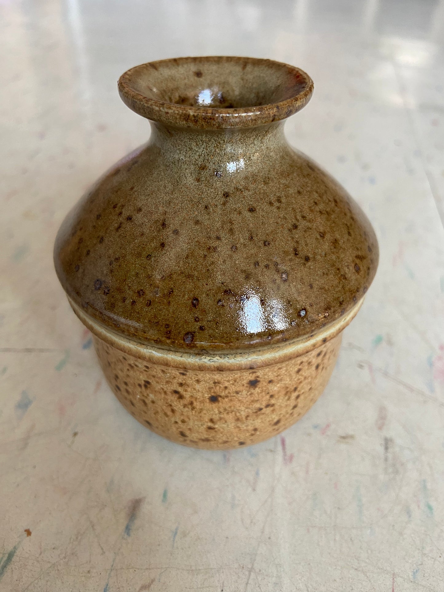 Small brown and multicolored glazed vase