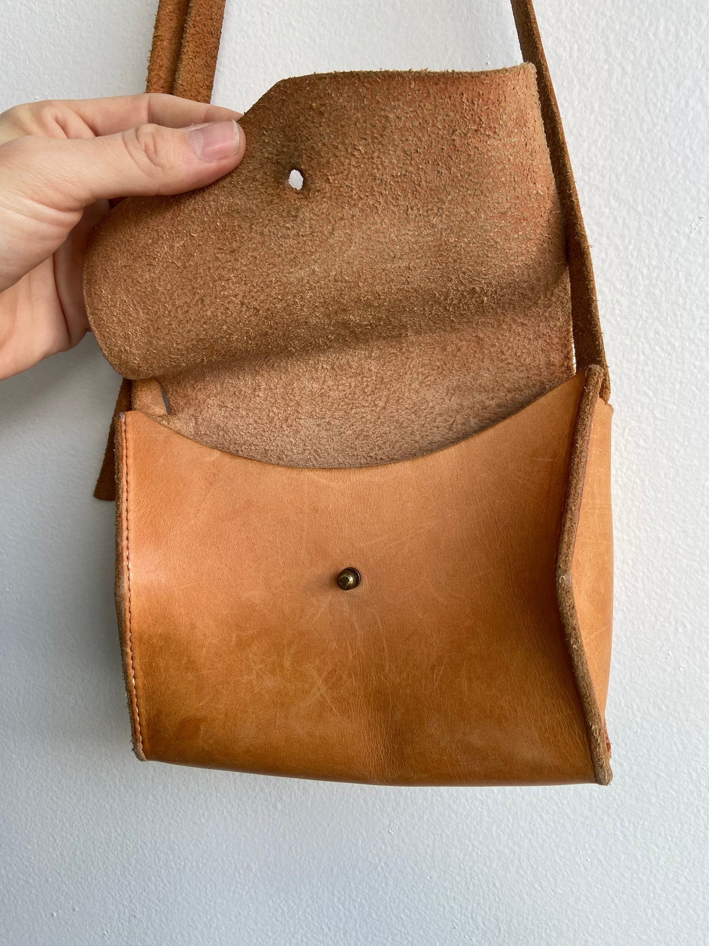 Warm brown leather purse with adjustable strap