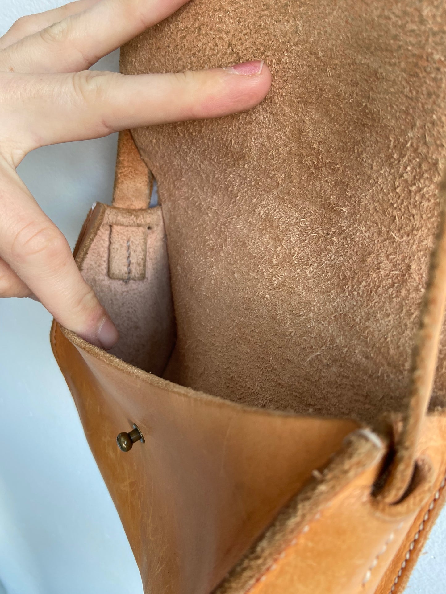 Warm brown leather purse with adjustable strap